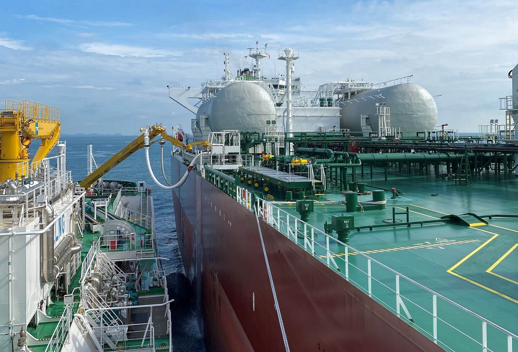 A detailed view of Sevington Energy's LNG transfer operations between two maritime vessels, showcasing advanced technology and efficient logistics in the oil and gas industry.